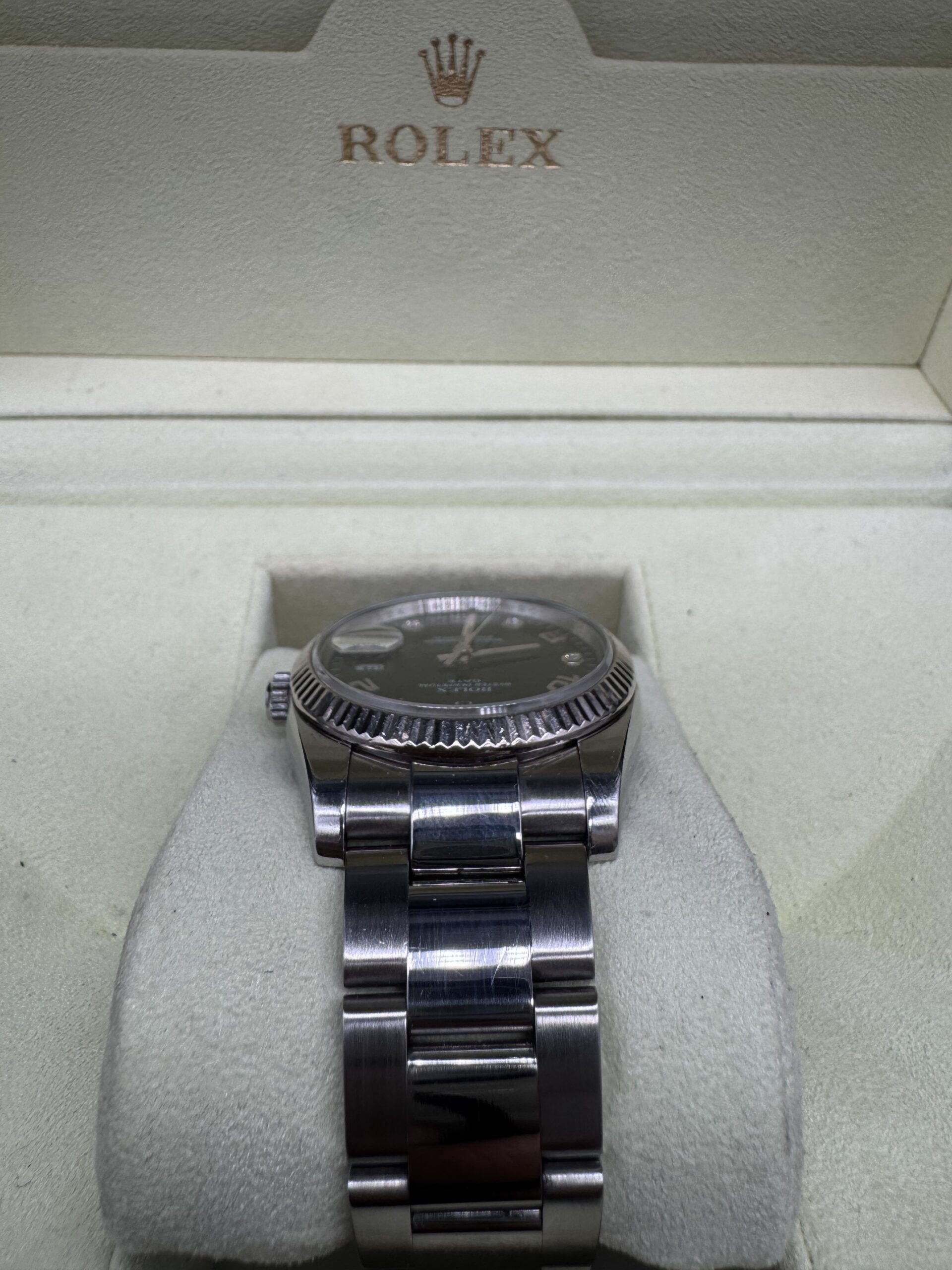 Rolex Oyster Perpetual Date 115234 index diamant année 2006