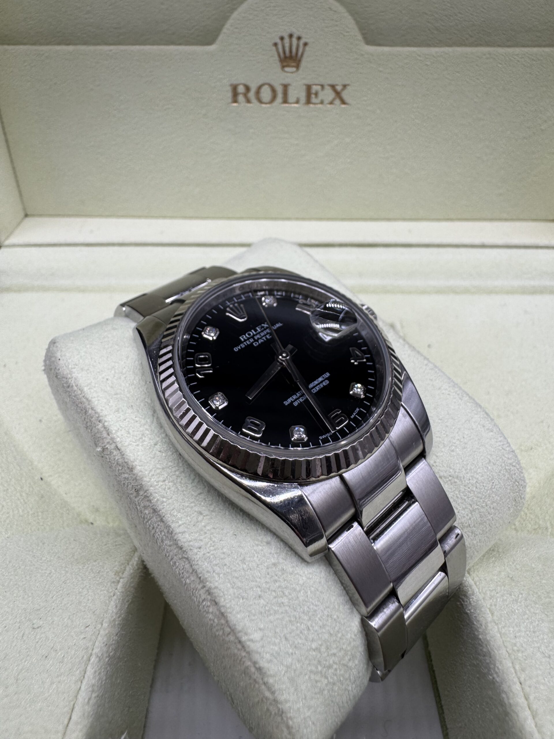 Rolex Oyster Perpetual Date 115234 index diamant année 2006